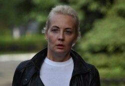 Yulia Navalnaya, wife of Russian opposition leader Alexei Navalny, walks near a hospital where Alexei receives medical treatment in Omsk, Russia, Aug. 21, 2020.