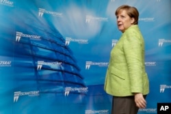 German Chancellor Angela Merkel arrives for a reception of the Economy Council of the German Christian Democratic Party in Berlin, Germany, June 27, 2017.