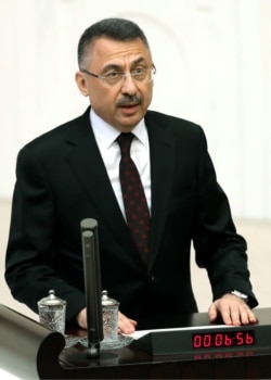 FILE - Turkish Vice President Fuat Oktay speaks at the Grand National Assembly of Turkey (TBMM) in Ankara, Turkey, July 10, 2018.