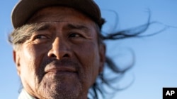 Navajo Richard Begay poses for a portrait while taking a break from herding his goats, on the Navajo Nation in Dilkon, Ariz., Oct. 17, 2024. 