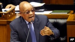 FILE - South African President Jacob Zuma answers questions in parliament in Cape Town, South Africa, March 17, 2016. Zuma has been ordered to pay $500,000 to reimburse the treasury for using public funds to pay for upgrades at his home.