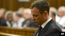 FILE - Oscar Pistorius sits in court, after judge Thokozile Masipais sentenced him to five years in prison, in Pretoria, South Africa, Oct. 21, 2014.