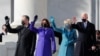 President-elect Joe Biden, his wife Jill Biden, Vice President-elect Kamala Harris and her husband Doug Emhoff salute as they arrive ahead of the inauguration of Biden, in Washington, Jan. 20, 2021. 
