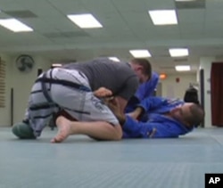 For instructor Luis Pantoja (right on floor) , teaching injured soldiers Brazilian Jiu Jitsu has been a learning process for him as well.