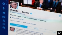 FILE - A photo shows President Donald Trump's Twitter feed on a computer screen.