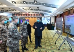 Chinese President Xi Jinping learns about the hospital's operations, treatment of patients, protection for medical workers and scientific research in Wuhan, the epicentre of the novel coronavirus outbreak, Hubei province, China, March 10, 2020.