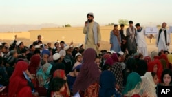 FILE - Matiullah Wesa, a girls' education advocate, reads to students in the Spin Boldak district in the southern Kandahar province of Afghanistan on May 21, 2022. The Taliban freed the activist on Oct. 26, 2023, after holding him in prison for 215 days.