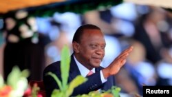Kenya's President Uhuru Kenyatta reacts as he attends Mashujaa (Heroes) Day at the Nyayo National Stadium in capital Nairobi, Oct. 20, 2013.