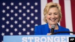 FILE - Democratic presidential candidate Hillary Clinton pauses while speaking at a rally at Johnson C. Smith University, in Charlotte, N.C., Sept. 8, 2016.