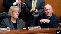 FILE - In this Jan. 31, 2017, photo, Senate Health, Education, Labor, and Pensions Committee Chairman Sen. Lamar Alexander, R-Tenn., and the committee's ranking member Sen. Patty Murray, D-Wash., are seen on Capitol Hill in Washington.