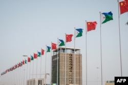 FILE - National flags of China and Djibouti are seen in front of Djibouti International Free Trade Zone (DIFTZ) before the inauguration ceremony in Djibouti, July 5, 2018.