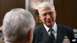 Navy Vice Adm. Craig Faller (R) talks with Senate Armed Services Committee ranking member Sen. Jack Reed, D-R.I., after a hearing on Capitol Hill in Washington, Sept. 25, 2018.