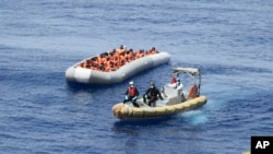 This undated image made available on May 30, 2016, by the Italian Navy Marina Militare shows migrants being rescued at sea.