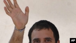 Rahul Gandhi waves during an election campaign rally ahead of state assembly elections in the southern Indian state of Tamil Nadu, April 6, 2011