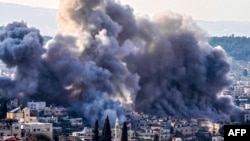 Smoke billows from the site of several explosions during an Israeli raid on the Jenin camp for Palestinian refugees, Feb. 2, 2025.