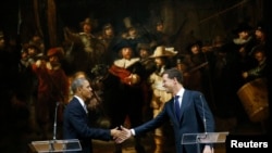Iranian worshipers recite verses of the Quran, Islam's holy book, during the Muslim holy fasting month of Ramadan at the shrine of Saint Mohammad Helal Ibn Ali in the city of Aran and Bidgol, some 140 miles (225 kilometers) south of the capital Tehran.