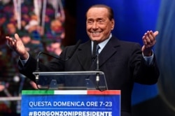 Former Italian Prime Minister and leader of the Forza Italia (Go Italy!) party Silvio Berlusconi gestures during a rally ahead of a regional election in Emilia-Romagna, in Ravenna, Jan. 24, 2020.