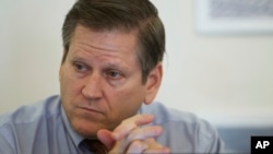 FILE - Phil Robertson, deputy director of Human Rights Watch's Asia division, attends a press conference in Phnom Penh, Cambodia, March 12, 2015. 