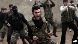 FILE - Syrian rebels attend a training session in Maaret Ikhwan near Idlib, Syria. 