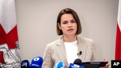 Belarusian opposition leader Sviatlana Tsikhanouskaya speaks during her news conference in Vilnius, Lithuania, Wednesday, July 7, 2021. (AP Photo/Mindaugas Kulbis)