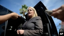FILE - Then-Puerto Rico Justice Secretary Wanda Vazquez answers reporters' questions, in San Juan, Puerto Rico,Jan. 16, 2018.