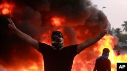 صحنه ای از اعتراضات عراقی ها در روز پنجشنبه، بغداد