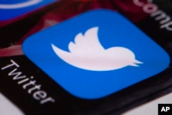 FILE - The Twitter app is seen on a mobile phone in Philadelphia, April 26, 2017.