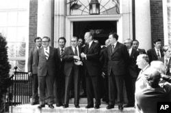 Soviet General Secretary Leonid Brezhnev shakes hands with U.S. President Ford after their first round of talks at the American Embassy in Helsinki, July 30, 1975.