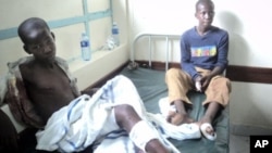 Two children who survived a grenade attack by suspected al-Shabab members on a church are seen in a hospital in Garissa, Kenya, November. 6, 2011.