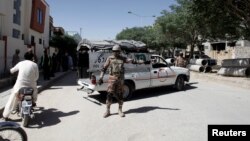 FILE - A soldier stands guard near the site where two Chinese nationals were kidnapped by unidentified gunmen, in Quetta, Pakistan, May 24, 2017. 
