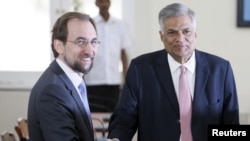 FILE - U.N. High Commissioner for Human Rights Zeid Ra’ad Al Hussein, left, shakes hands with Sri Lankan Prime Minister Ranil Wickremesinghe during their meeting in Colombo, Feb. 9, 2016. The human rights chief was assessing the country's progress in prosecuting alleged war crimes. 
