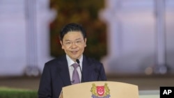 新加坡新任总理黄循财2024年5月15日晚在总统府宣誓就职。（新加坡政府照片）