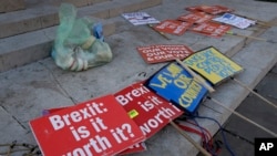 Brexit banners lie on the ground near parliament in London, Britain, Jan. 17, 2019.