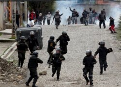 Supporters of former President Evo Morales clash with police in La Paz, Bolivia.