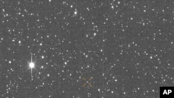 This image made available by University of Hawaii's asteroid impact alert system shows the motion of asteroid 2024 YR4 over about one hour, Dec. 27, 2024. (ATLAS / University of Hawaii / NASA via AP