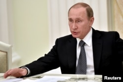 Russian President Vladimir Putin attends a meeting at the Kremlin in Moscow, March 23, 2016.