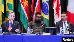U.S. Secretary of State Antony Blinken speaks beside Guyana President Irfaan Ali and Jamaican Prime Minister Andrew Holness at an emergency meeting on Haiti at the Conference of Heads of Government of the Caribbean Community (CARICOM) in Kingston, Jamaica, March 11, 2024. 