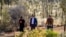 Australian Prime Minister Anthony Albanese, center, walks to a meeting with Indigenous leaders from central Australia in the Uluru Kata Tjuta National Park in central Australia on Oct. 10, 2023.