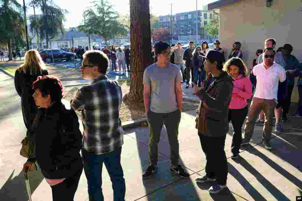 Voters wait at the North Hollywood Amelia Earhart Regional Library in Los Angeles on Nov. 8, 2016.