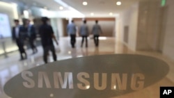 FILE - The corporate logo of Samsung Electronics Co. is seen at its shop in Seoul, South Korea, Oct. 12, 2016.