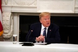 President Donald Trump speaks during a meeting with Republican lawmakers, in the State Dining Room of the White House, May 8, 2020, in Washington.