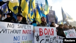 French President Emmanuel Macron will bring together Russian President Vladimir Putin and his Ukrainian counterpart Volodymyr Zelensky for their first face-to-face meeting at at the Elysee Palace in Paris on Dec. 9, 2019.