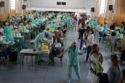 Teachers and auxiliary staff take COVID-19 tests in Madrid, Spain, Sept. 2, 2020.