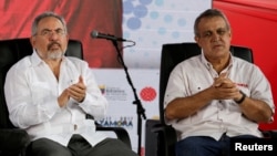 FILE - Venezuela's then-Oil Minister Nelson Martinez (L) and Eulogio del Pino, president of Venezuelan state oil company PDVSA, are seen at a swearing-in ceremony of the new board of directors of PDVSA in Caracas, Venezuela, Jan. 31, 2017.