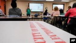 Claire Woodall-Vogg, executive director of the City of Milwaukee Election Commission, teaches a class to poll workers Saturday, Oct. 22, 2022, in Milwaukee. 