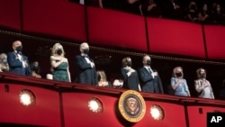 From left, Berry Gordy, first lady Jill Biden, President Biden, VP Kamala Harris, second gentleman Doug Emhoff, and others, stand for the national anthem at the Kennedy Center in Washington, Dec. 5, 2021.