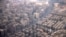 FILE - An aerial view of traffic and buildings, as pictured through the window of an airplane, in Cairo, Feb. 6, 2025.