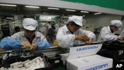 FILE - An assembly line in a Foxconn plant.