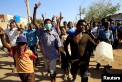 Sudanese demonstrators march during anti-government protests in Khartoum, Sudan, Jan. 24, 2019.