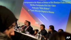 Syrians brought to The Hague by Russia in a move to discredit reports of an April 7, 2018, chemical weapons attack in the Syrian town of Douma appear at a press conference in The Hague, Netherlands, April 26, 2018, after briefing members of the Organization for the Prohibition of Chemical Weapons, (OPCW). 